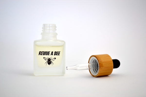 bee revival refill bottle open showing glass pipette